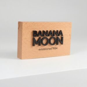 Natural beech wood table sign with custom 3D engraved logo for retail counter and office branding, 10x5x1 inch.