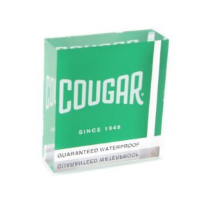 Custom paperweights made of 1.5-inch thick clear acrylic with a reverse-printed white logo on a green background.