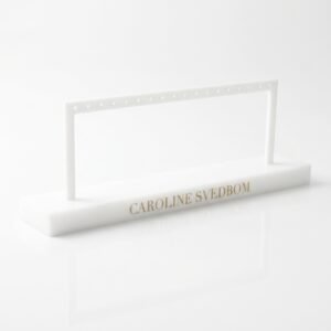 White acrylic earring display stand with 18 holes and stable detachable base for 9 pairs of earrings.