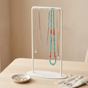 Cream white metal necklace display stand with 25-inch height and etched logo for long pendant presentation.