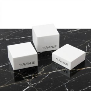 3-piece white acrylic jewelry display risers for rings and bracelets with custom logo branding.