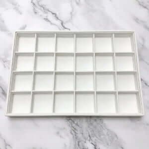 White PU leather 24-compartment jewelry tray for earring and stud display with custom logo option